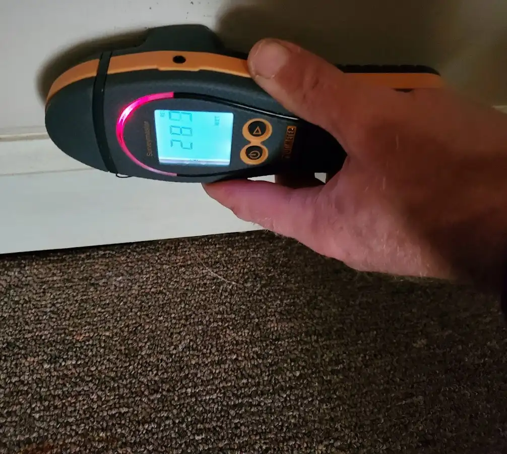 Moisture detection at baseboard during Storm Damage Restoration in Barre